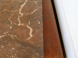 a close up of a table with a marble top on it
