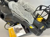 someone is cleaning a motorcycle with a sponge and a cloth
