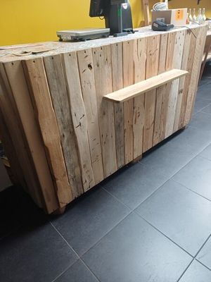 a picture of a wooden counter in a restaurant