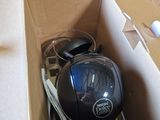 a box with a computer mouse and other items in it