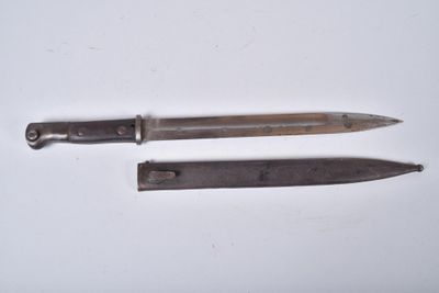 two knives that are laying on a white surface