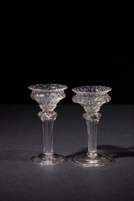 pair of crystal wine glasses on a black background