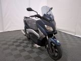 a motorcycle that is parked on a checkered floor