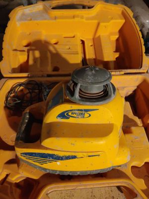 a yellow toy boat sitting on top of a pile of other toys