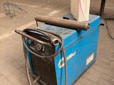 a machine that is sitting on the ground in the garage