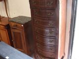 a chest of drawers and a chest of drawers in a room