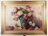 a painting of flowers in a vase on a easel
