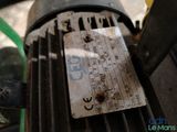 a close up view of a motor with a tag on it