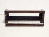 a small wooden shelf with a mirror on it