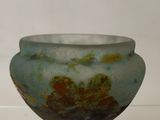 a glass bowl that is sitting on a table