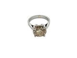 a close up of a diamond ring on a white background