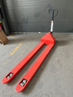 a fork and a fork on the ground in front of a garage door