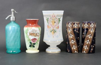 four vases and a soap dispenser on a table
