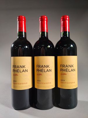 three bottles of frank phelan red wine sit on a table