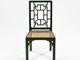 a black chair with a wicker seat on a white background