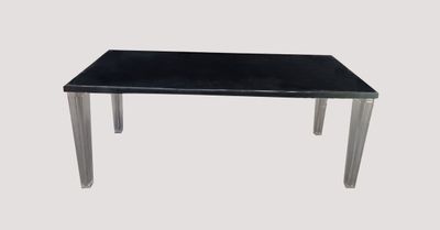 a black table with a glass top on a white background