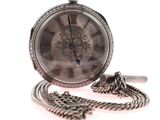 a silver pocket watch with a chain on a white background