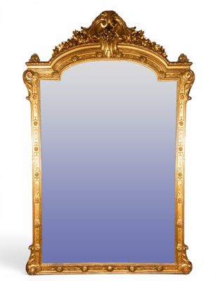 an antique gold framed mirror with a blue glass in the middle