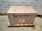 the box is sitting on a pallet in front of a wall