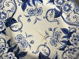 a blue and white plate with blue flowers on it