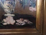 a painting of flowers in a vase on a table