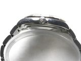 a close up of a watch on a white surface