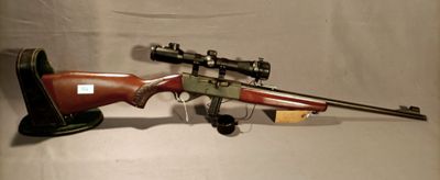 the rifle is laying on the table ready to be used