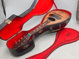 a guitar and a guitar case on a table