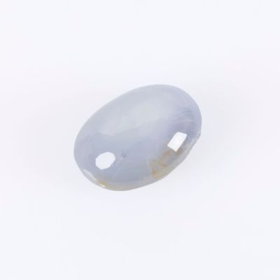 a close up of a white jade stone on a white surface