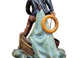 figurine of a man and woman on a boat with a life preserver