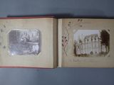 an old photo of a book opened to show a picture of a castle