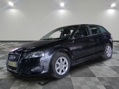 a picture of a black car parked in a garage