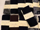 several pairs of men ' s black and brown socks on a white surface
