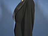 a black jacket on a mannequin stand against a blue background