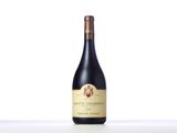 the bottle of wine is sitting on the table with a white background