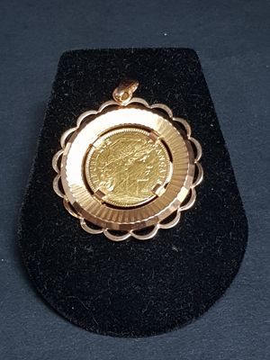 a gold coin in the middle of a black case