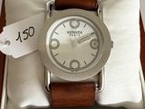 a watch in a box with a price tag on it