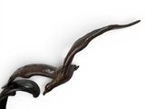 a sculpture of a bird that is on top of a table