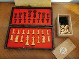 a box of chess pieces and a box of chess pieces on a table