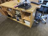 a desk with a chair and a computer on it