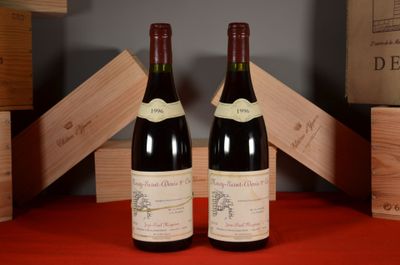 two bottles of wine sitting next to each other on a table