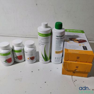 a bottle of aloe vera and several bottles of aloe vera