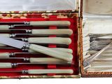 a box that has a set of knives and spoons in it