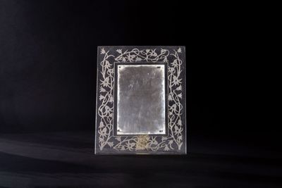 an image of a silver picture frame on a black background