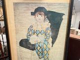 painting of a woman in a blue dress and a hat on a easel