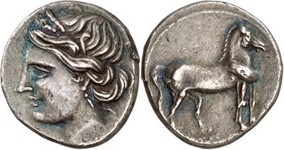 a silver coin with a woman and horse on it