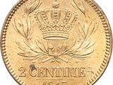a close up of a gold coin with a crown on it