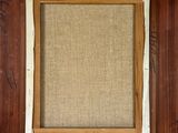 an old picture frame with a picture of a man and a woman