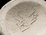 an image of a stone bowl with a bird on it
