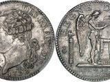 a silver coin with an image of a man and a woman on it